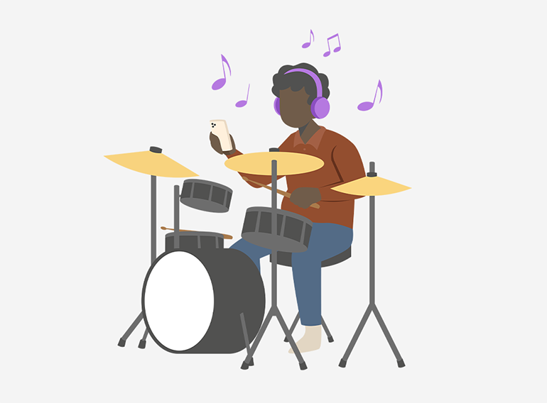 Seorang pria menikmati berlatih drum menggunakan fungsi pemisah stem dari aplikasi latihan musik Extrack